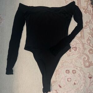 Black cut out bodysuit with mesh sleeves